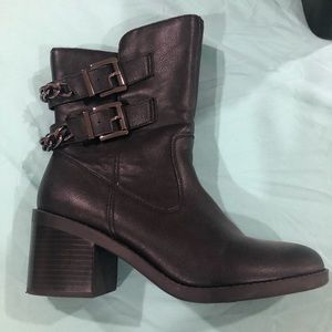 Black mid-calf boots.